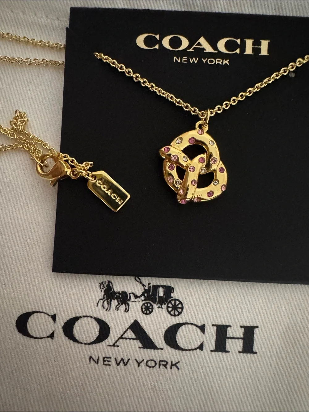 Coach Gold Pretzel Pendant Necklace with Pink Accents